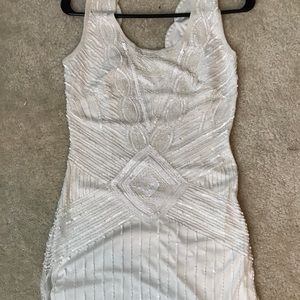 White beaded dress with scallop floating trim